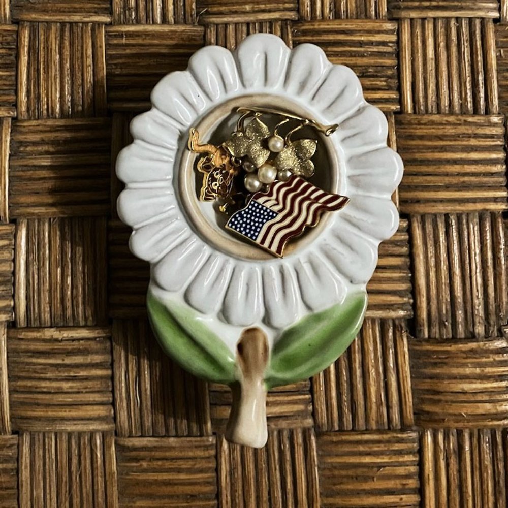 display your tiny treasures in this lovely flower shaped egg cup.